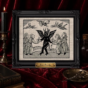 May include: A framed cross-stitch embroidery featuring a black and white illustration of a central winged figure surrounded by four people and three flying creatures. A gold-colored plaque at the bottom of the black frame reads Ars Onirika.