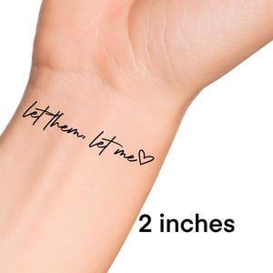 May include: Let them, let me temporary tattoo with a heart symbol. The tattoo is 2 inches in size.
