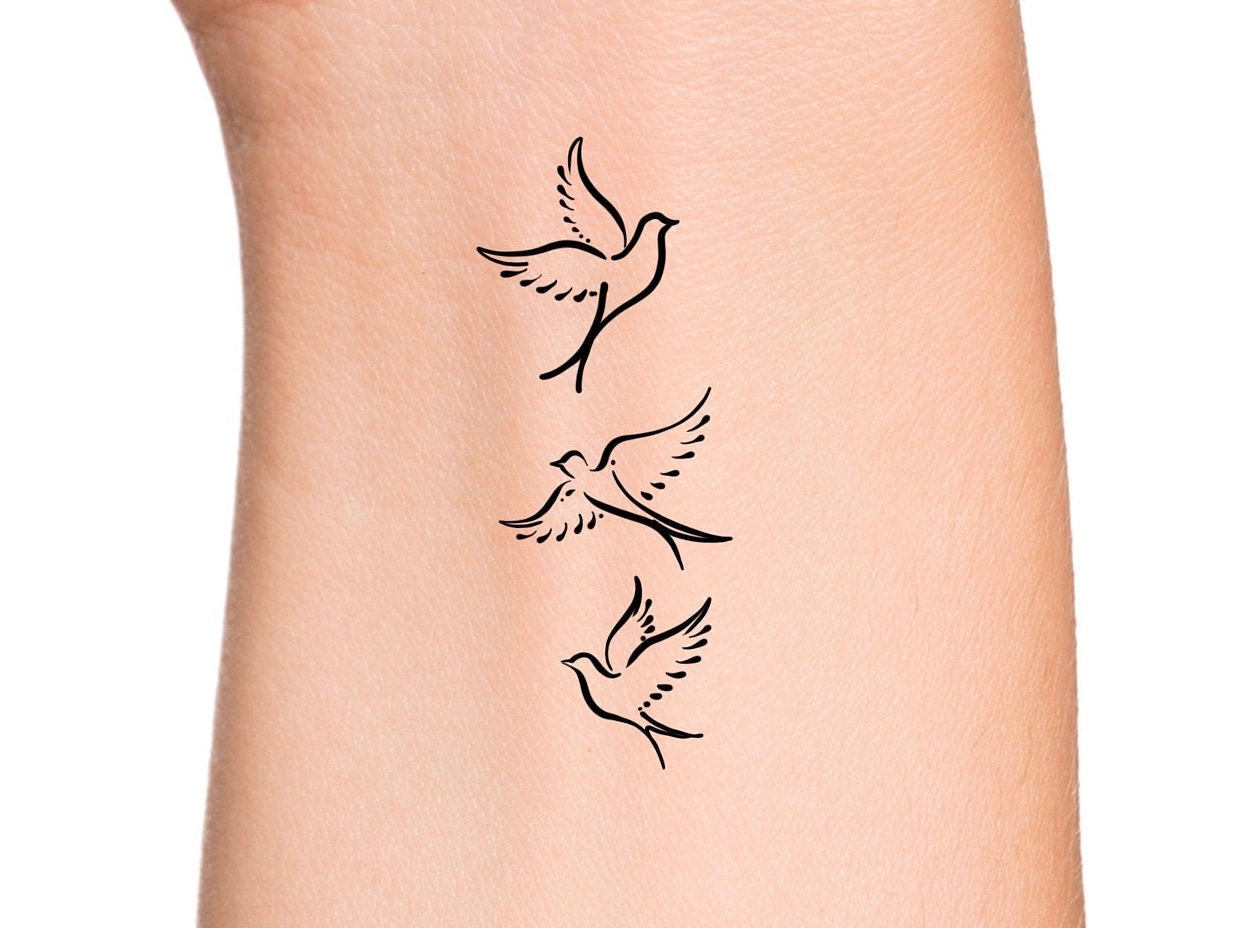 Beautiful dove tattoo on the arm - Tattoogrid.net