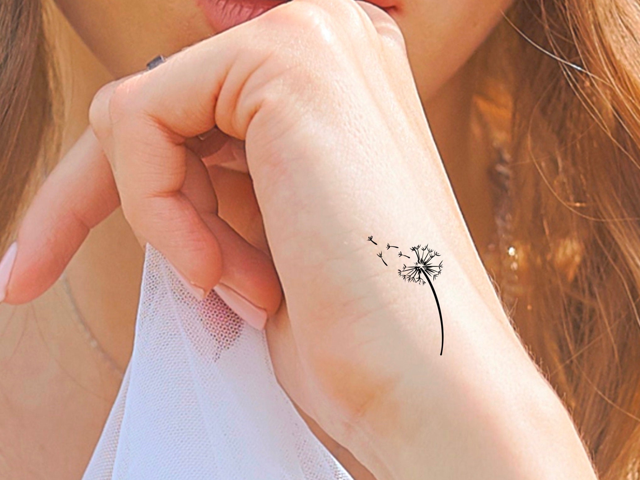 Dandelion tattoo on the inner wrist