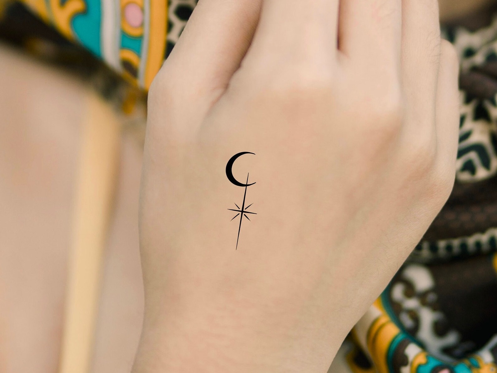 Minimalist sun moon and star tattoo on the inner