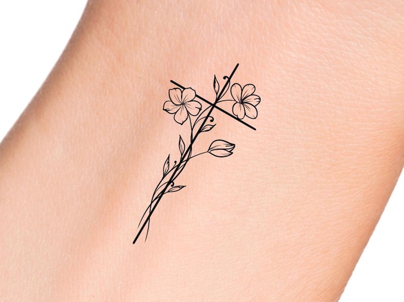 May include: A simple black line drawing of a cross with flowers on a white background.