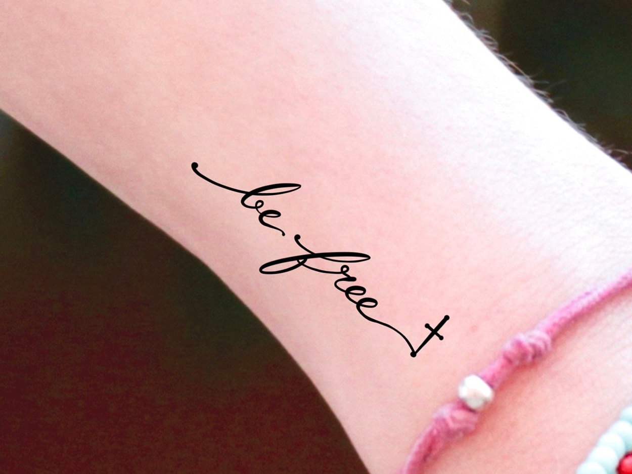 freedom tattoo on wrist