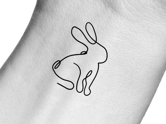 Tattoo uploaded by Tattoodo • Bunny tattoo by Minnie #Minnie #bunnytattoo  #illustrative #linework #fineline #realistic #bunny #rabbit #nature #animal  #cute #small #detailed • Tattoodo