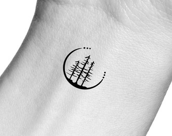 May include: A simple black line drawing tattoo design of three trees inside a circle with dots around the circle.