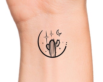 May include: A black line drawing of a cactus with a crescent moon and stars in a circle around it.