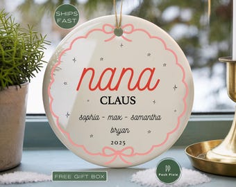 May include: A round white ceramic ornament featuring a pink scalloped border with a bow at the top and bottom. The text reads nana CLAUS, followed by the names sophia - max - samantha, bryan, and the year 2025, accented with small star icons.