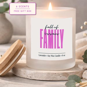 May include: A set of three ceramic canisters with lids. The canisters are white with a blue floral pattern. The largest canister is 8 inches tall, the medium is 7 inches, and the smallest is 6 inches.