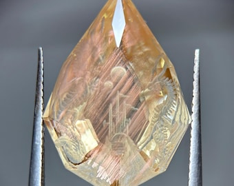 Precision cut Oregon Sunstone with epic dragon kingdom carving! 12.65ct