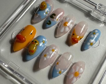 Duckpond themed press on nails with daisies and blue French tips medium almond