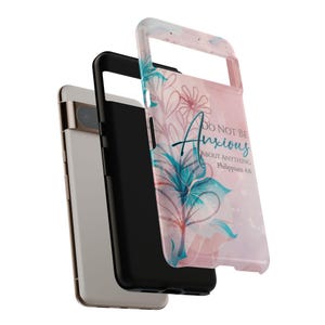 May include: A pink and blue phone case with a floral design and the text "Do not be anxious about anything Philippians 4:6".