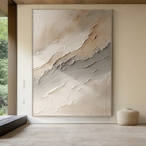 May include: Abstract painting with a textured, layered look. The painting features shades of beige, brown, and gray, creating a calming and modern aesthetic.
