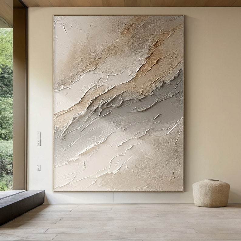 May include: Abstract painting with a textured, layered look. The painting features shades of beige, brown, and gray, creating a calming and modern aesthetic.