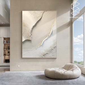 May include: Abstract wall art featuring a white and gold textured design with a modern minimalist style.
