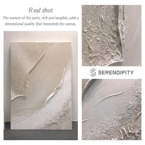 May include: A white and beige abstract painting with a textured surface. The painting has a modern and minimalist style. The text "SERENDIPITY" is visible in the lower right corner of the image.