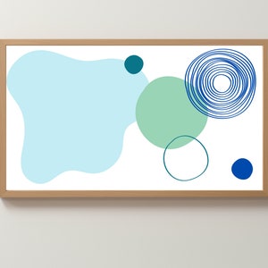 Puede incluir: Impresión de arte abstracto con un esquema de color azul, verde y blanco. La impresión presenta una gran mancha azul, un círculo verde, un círculo azul más pequeño y un círculo azul con anillos concéntricos.
