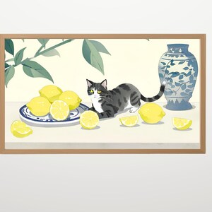 May include: A framed illustration of a gray and white cat with yellow eyes, sitting on a table with lemons and a blue and white vase. The cat is looking at the viewer.