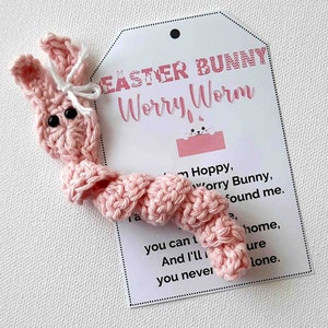 May include: Pink crocheted Easter bunny worry worm with a tag that reads "Easter Bunny Worry Worm" and a poem about being there for someone.