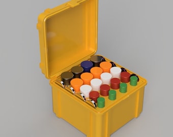 Puede incluir: Una caja de plástico amarilla con una tapa con bisagras, abierta para revelar una variedad de pequeños recipientes redondos y coloridos. Los recipientes están dispuestos en filas y están llenos de líquidos de diferentes colores.