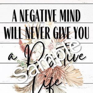 May include: A white wood sign with black text that reads "A negative mind will never give you a positive life". The sign is decorated with a floral arrangement of dried flowers and grasses in shades of pink, beige, and brown.