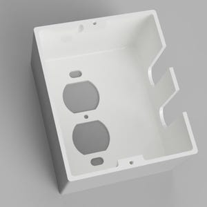 Puede incluir: Caja blanca para enchufes eléctricos con dos aberturas circulares para enchufes. La caja tiene forma rectangular y un diseño limpio y moderno. Probablemente hecha de plástico, está destinada a instalaciones eléctricas.