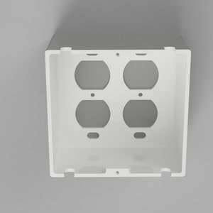 May include: White plastic electrical box with four round openings for electrical outlets.