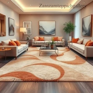 May include: A modern living room with two cream sofas, orange cushions, and a patterned rug with orange swirls. Artwork adorns the walls, and a coffee table sits in the center. The room is bright, and the text "Zamzamteppichgallery" is visible.