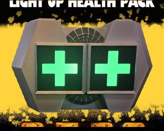 May include: A light-up health pack with the text "LIGHT UP HEALTH PACK" at the top. The pack has two green crosses on the front. The text "R.E.P.O." is at the bottom. The background is yellow and black.