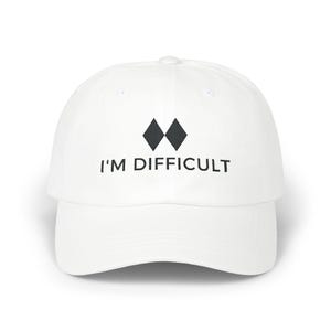 May include: White baseball cap with a black diamond logo and the text "I'M DIFFICULT" embroidered on the front.
