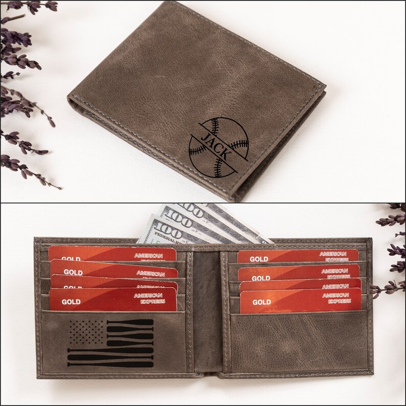 May include: A gray leather wallet with a baseball and the name "JACK" engraved on the front. The wallet is open and has several credit cards and cash inside.