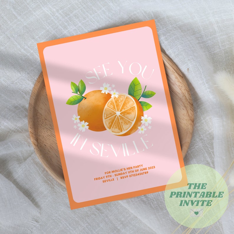 May include: Orange themed invitation for a hen party in Seville, Spain. The invitation features a watercolor illustration of an orange with white flowers and green leaves. The text reads "See you in Seville" and includes the date and RSVP information.