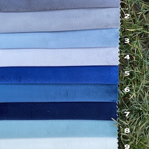 May include: A collection of ten fabric swatches arranged in horizontal strips, featuring various shades of blue and grey. Each swatch is numbered from 1 to 10, displaying a soft, matte texture. The colours range from light grey and pale blue to deep navy and vibrant royal blue.
