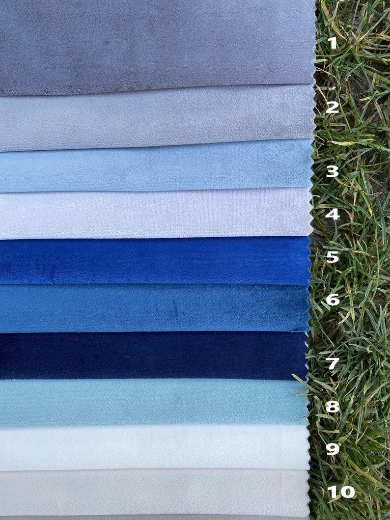 May include: A collection of ten fabric swatches arranged in horizontal strips, featuring various shades of blue and grey. Each swatch is numbered from 1 to 10, displaying a soft, matte texture. The colours range from light grey and pale blue to deep navy and vibrant royal blue.