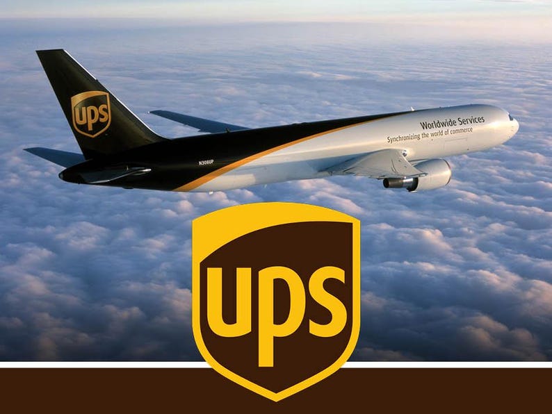 May include: A white and brown cargo airplane flying above clouds with the UPS logo on the tail and the text Worldwide Services Synchronizing the world of commerce on the fuselage, featuring a large UPS shield logo in the foreground.