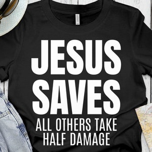 May include: Black t-shirt with white text that reads "Jesus Saves All Others Take Half Damage".