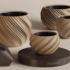 May include: A collection of beige-colored, spiral-patterned planters with dark interiors. The planters vary in size and are displayed on a dark brown circular base. A dark gray, angular object is also present.