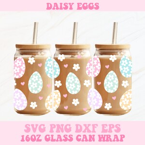 May include: Three 16oz glass can wraps with a daisy and egg design. The wraps feature pastel pink, blue, and yellow eggs with white daisies and pink hearts on a white background.