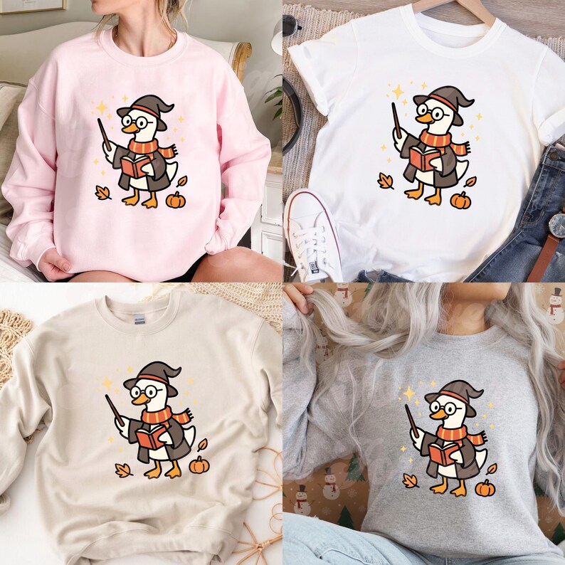 May include: Four different tops: a pink sweatshirt, a white t-shirt, a beige sweatshirt, and a gray sweatshirt. Each features a cartoon duck wearing a wizard hat, glasses, and a scarf, holding a wand and a book, with autumn leaves and pumpkins.