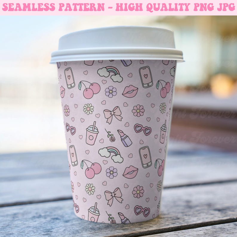 May include: A pink to-go coffee cup with a repeating pattern of hearts, cherries, rainbows, lips, sunglasses, bows, and cell phones. The pattern is in a light pink color with white outlines.
