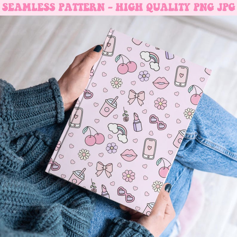 May include: A pink notebook with a cute, colorful, and girly pattern. The pattern includes hearts, cherries, rainbows, lips, sunglasses, bows, flowers, and cell phones.