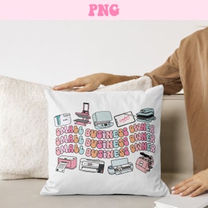 May include: White pillow with a colorful graphic of various printing and crafting tools, including a heat press, a Cricut machine, and a printer. The text "SMALL BUSINESS OWNER" is repeated four times in a colorful, retro font.