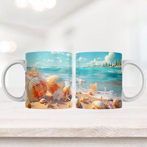 May include: Two white ceramic mugs with a beach scene printed on them. The scene features a blue ocean with white waves, a sandy beach, and seashells. The mugs are perfect for enjoying a hot beverage while dreaming of the beach.