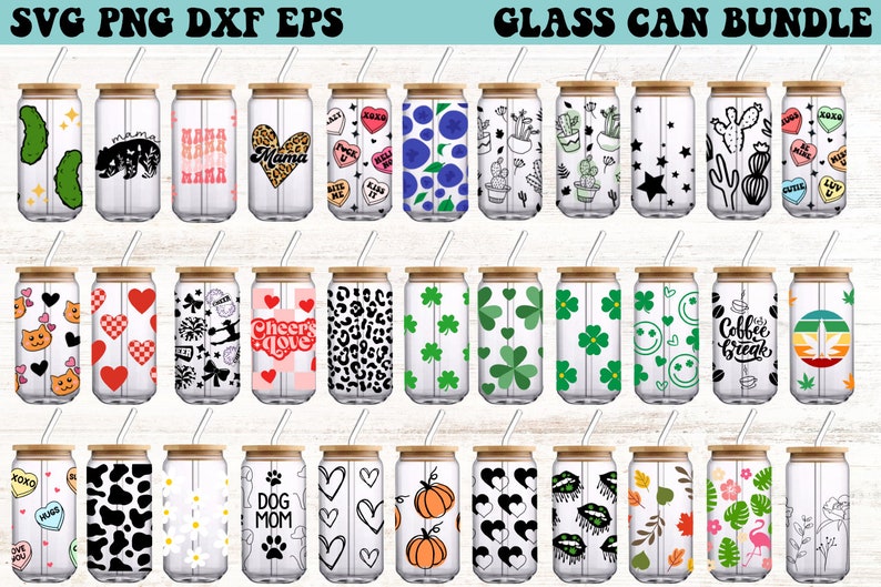 May include: A set of 20 glass can designs featuring various patterns and graphics. The designs include hearts, stars, flowers, animals, and text. The cans are all clear glass with a wooden lid and a straw.