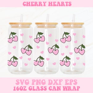 May include: Three clear glass 16oz can wraps with a pattern of pink cherries and hearts. The wraps are designed to be used on glass cans with a bamboo lid and a straw.