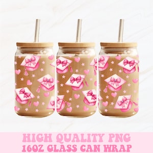 May include: Three glass can wraps with wooden lids and straws. The wraps feature a pattern of pink graduation caps, hearts, and stars. The text "HIGH QUALITY PNG 16OZ GLASS CAN WRAP" is displayed in pink.
