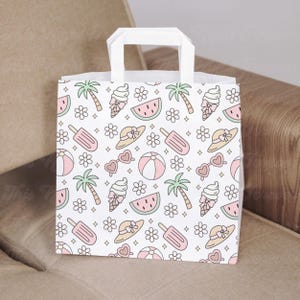 May include: White paper gift bag with a repeating pattern of summer-themed illustrations. The pattern includes pink ice cream cones, watermelon slices, palm trees, sunglasses, and flowers. The bag has a white handle.