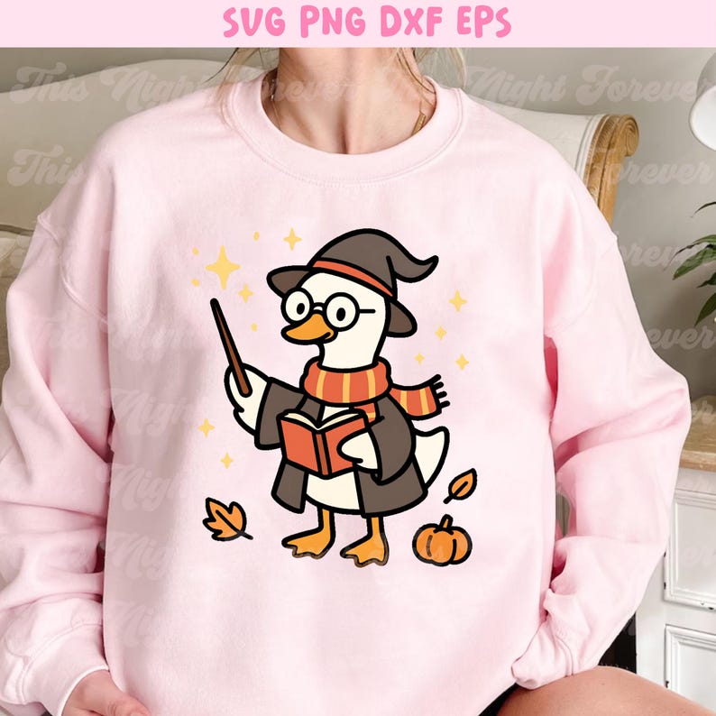 May include: Pink sweatshirt with a cartoon illustration of a wizard goose wearing a hat, glasses, and scarf, holding a wand and book. The design includes fall-themed elements like leaves and a pumpkin, with the text "SVG PNG DXF EPS" at the top.