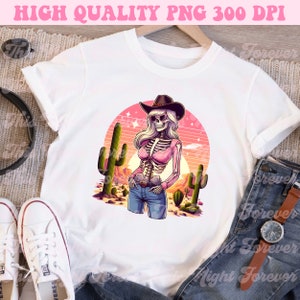 May include: White t-shirt featuring a cartoon skeleton cowgirl wearing a pink shirt, blue jeans, and a cowboy hat. The design includes cacti, a desert landscape, and the text "HIGH QUALITY PNG 300 DPI".