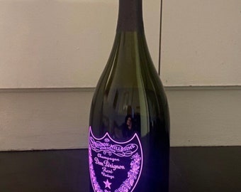 Empty Dom Pérignon Luminous Champagne Bottles 
