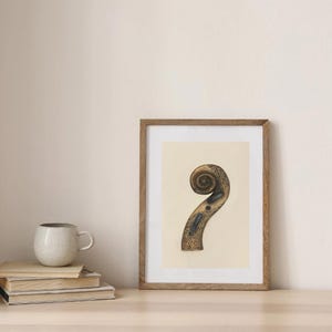 May include: A framed print featuring a detailed illustration of a violin scroll. The scroll is depicted in shades of brown and gold, with intricate patterns and a curved design. The artwork is displayed in a wooden frame.